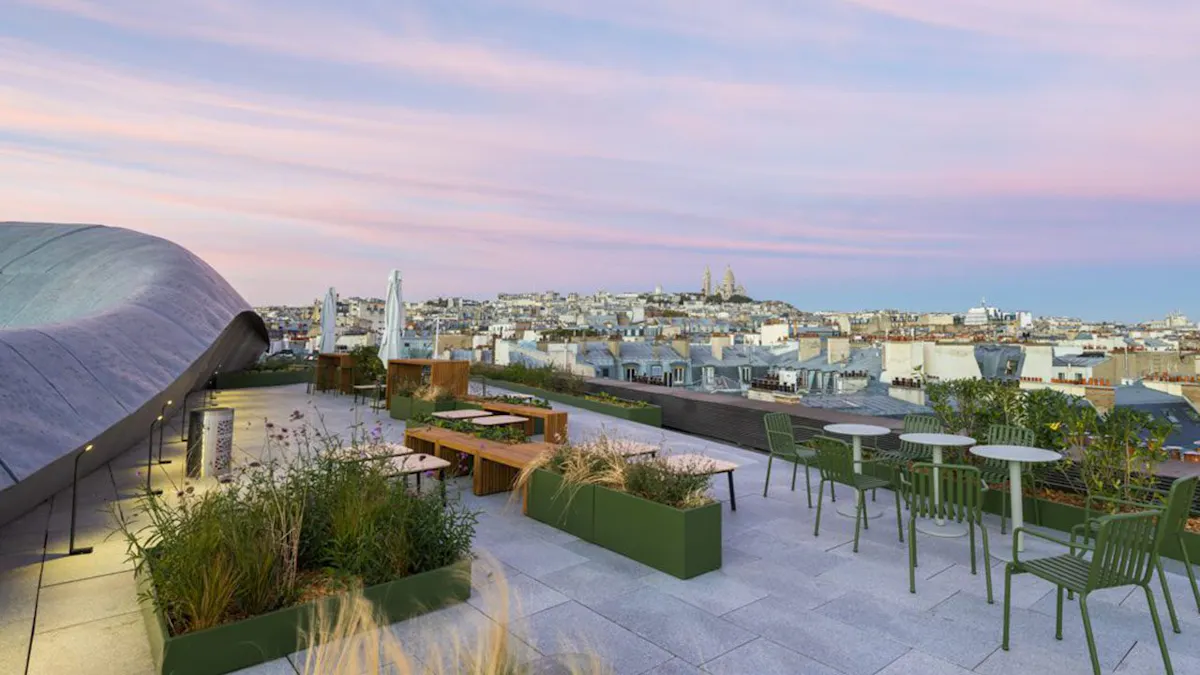 Outdoor Workspace and Terrace — Criteo, Paris by K2 Space Outdoor terrace workspace with seating and planting at Criteo Paris by K2 Space