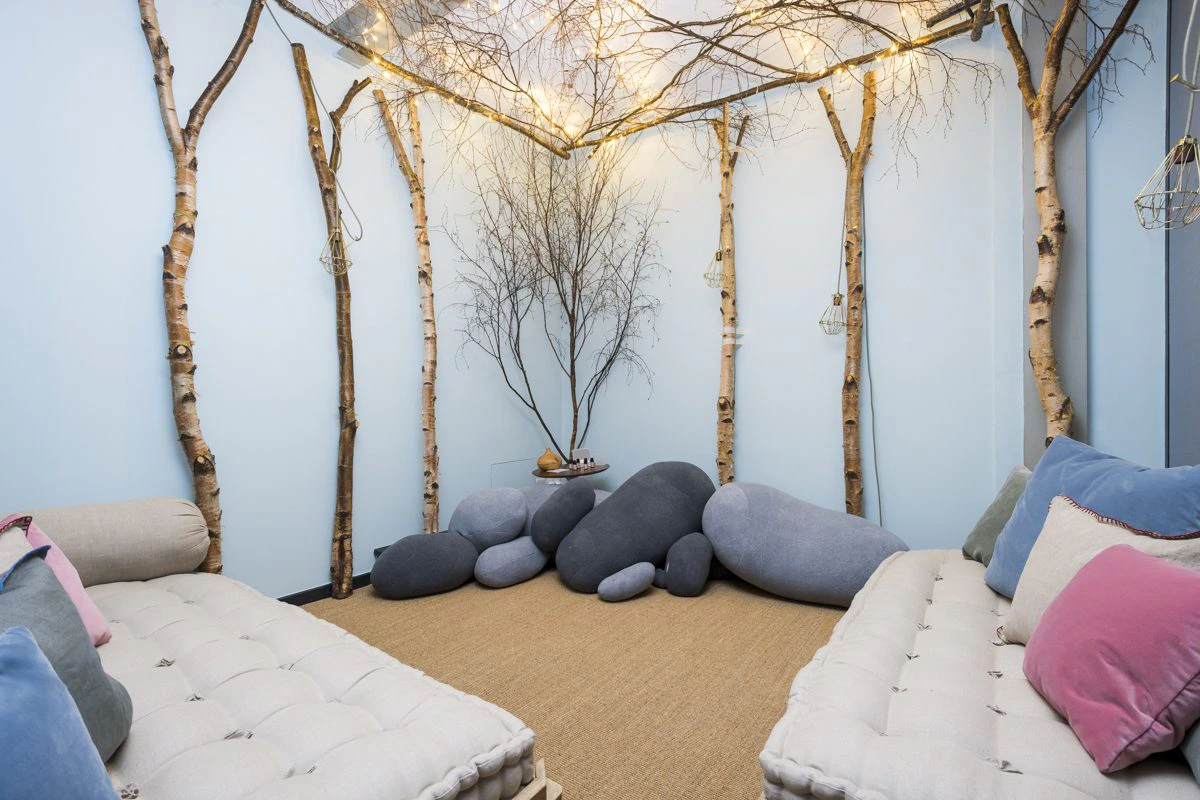 Quiet mindfulness and wellness recovery space with soft surfaces, low seating and dimmable warm lighting at Roald Dahl London by K2 Space