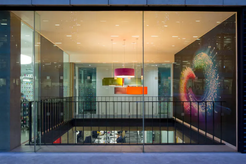 Brand expression with stone and glass branding at Adobe London by K2 Space