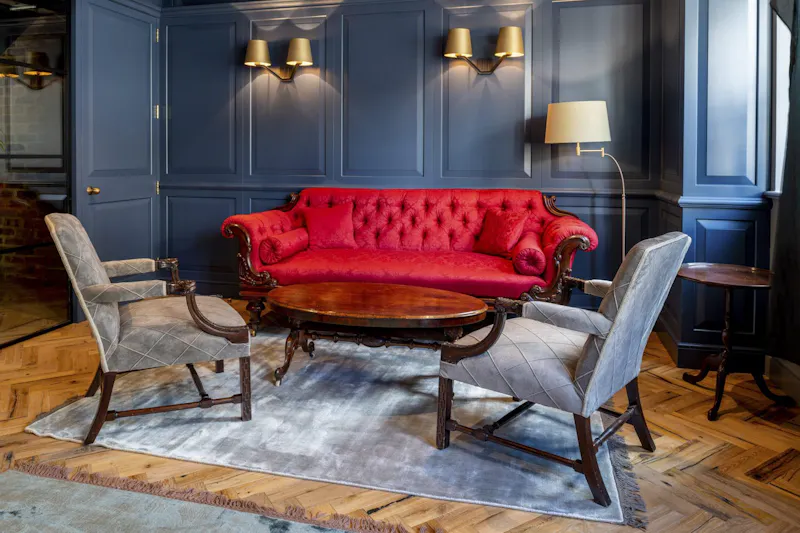Resimercial Breakout — Bericote, London by K2 Space Resimercial breakout area with layered lighting and upholstered seating at Bericote London by K2 Space