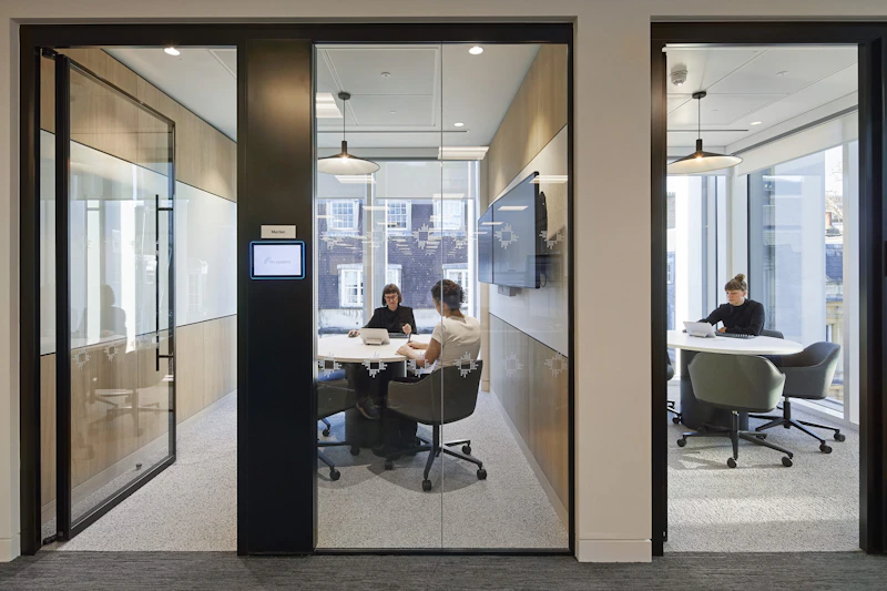 Glass-walled meeting room for hybrid video calls at a US Hedge Fund London SW1 by K2 Space