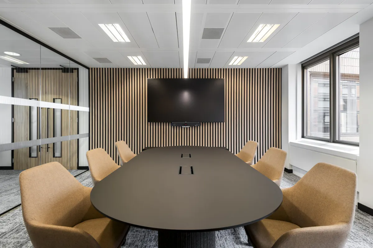 Meeting Room Design — IMSO, London by K2 Space Camera-ready boardroom with timber panelling and integrated AV at IMSO London by K2 Space