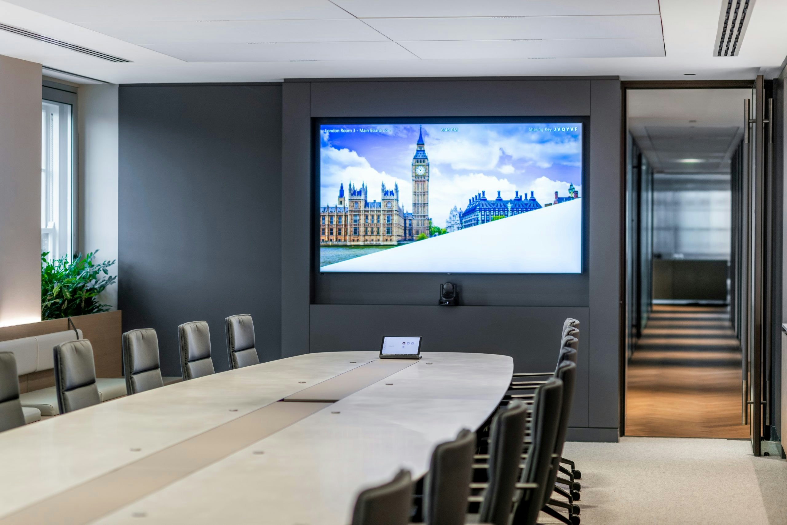 Global Private Investment Firm - Boardroom with Corian table and wall-mounted screen for meetings - Large
