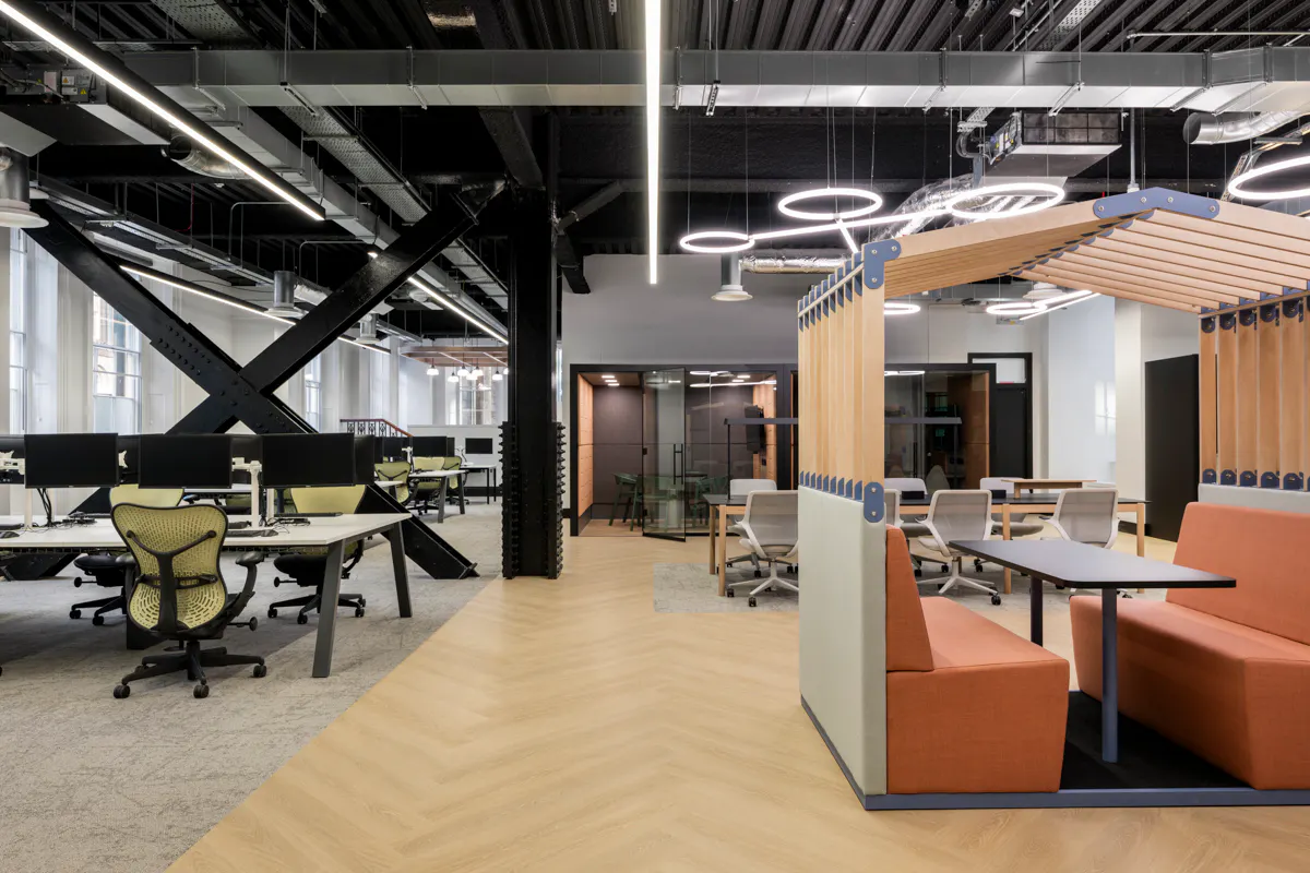 Ergonomic desk setup with sit-stand desk and supportive task seating specified by K2 Space
