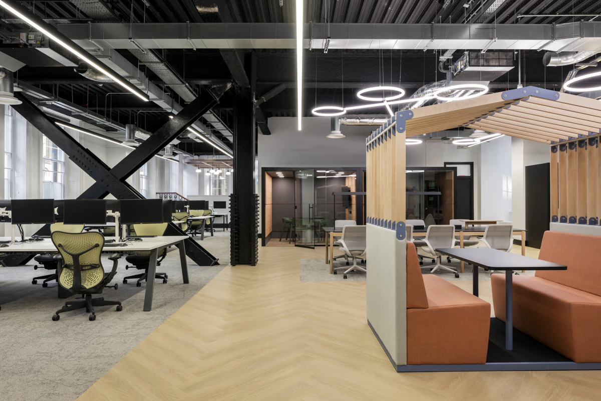 Ergonomic workstation setup with sit-stand desk and supportive task seating specified by K2 Space