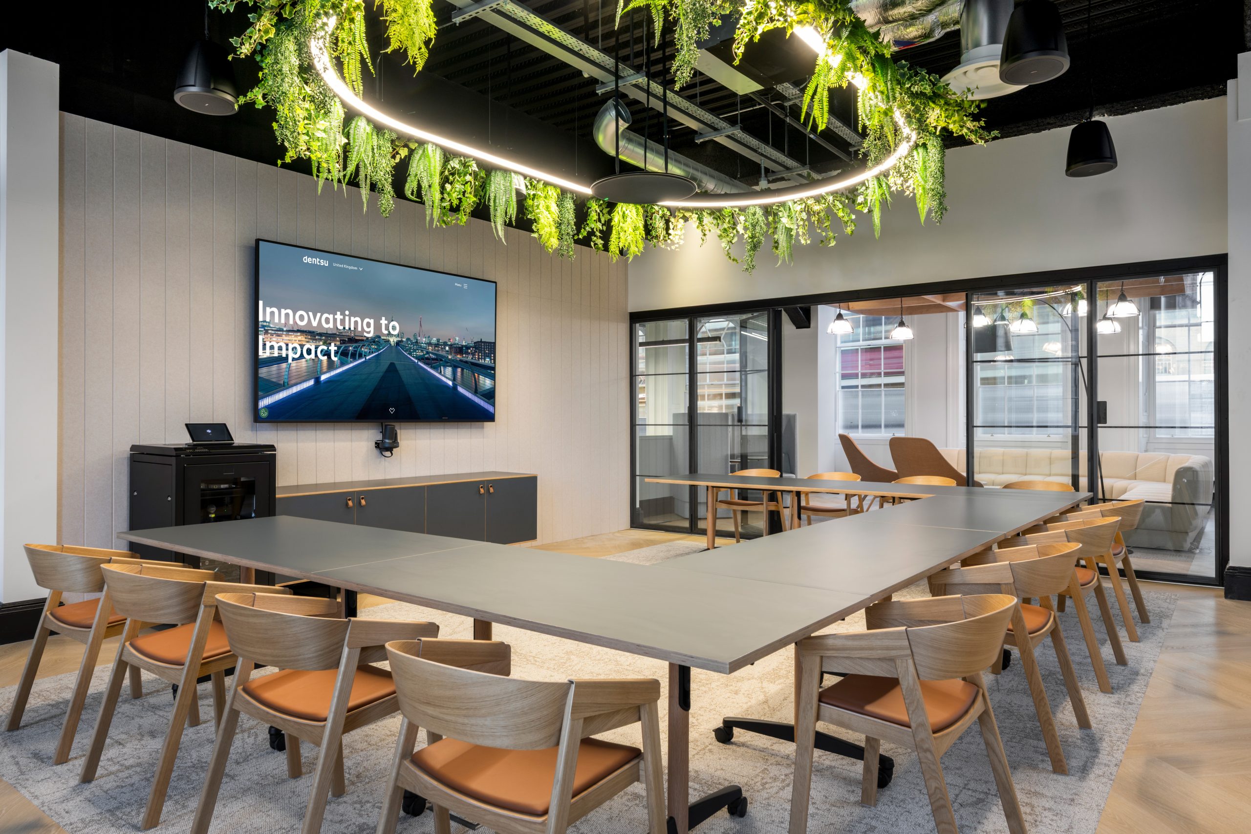 Dentsu mezzanine lounge in London with elevated views and abundant natural light supporting informal meetings and focused work