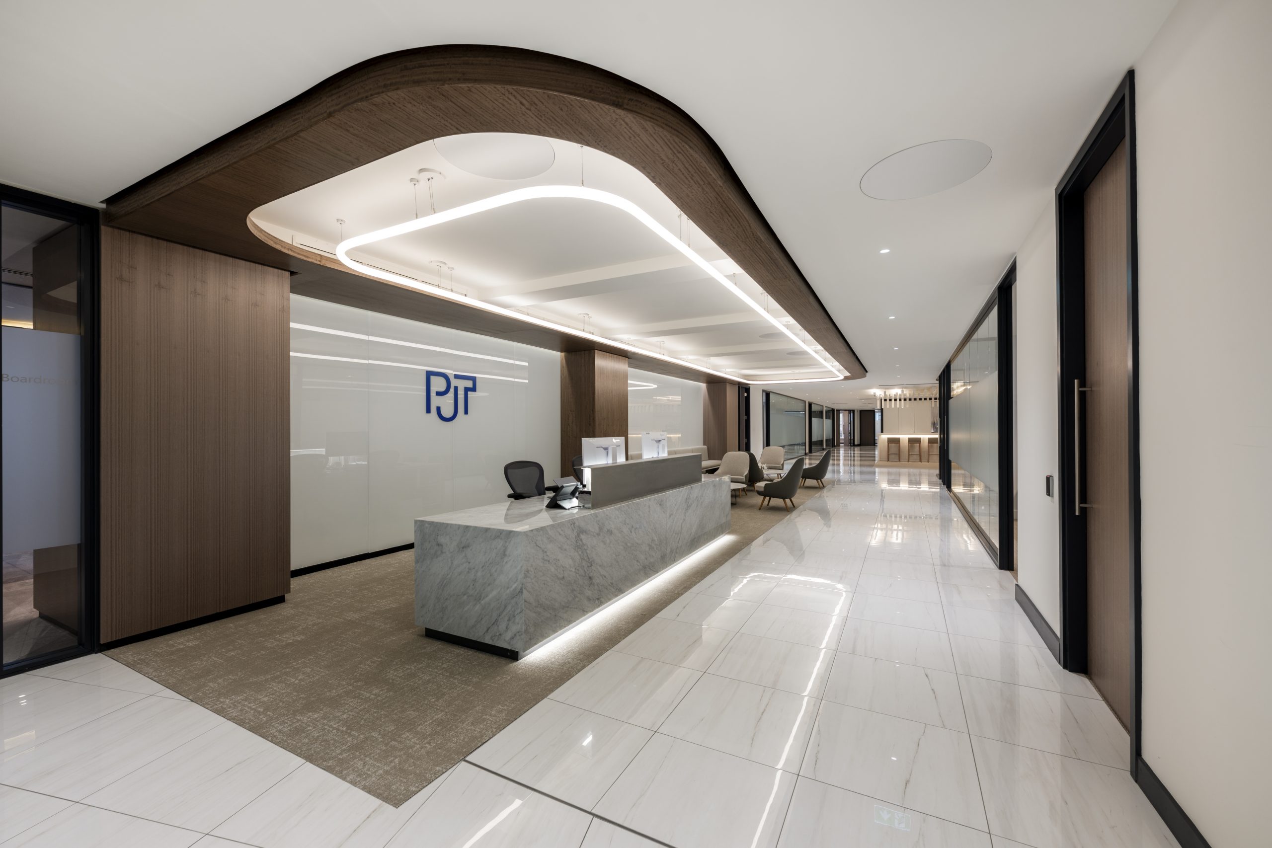 Marble reception desk and waiting area in a London advisory firm office