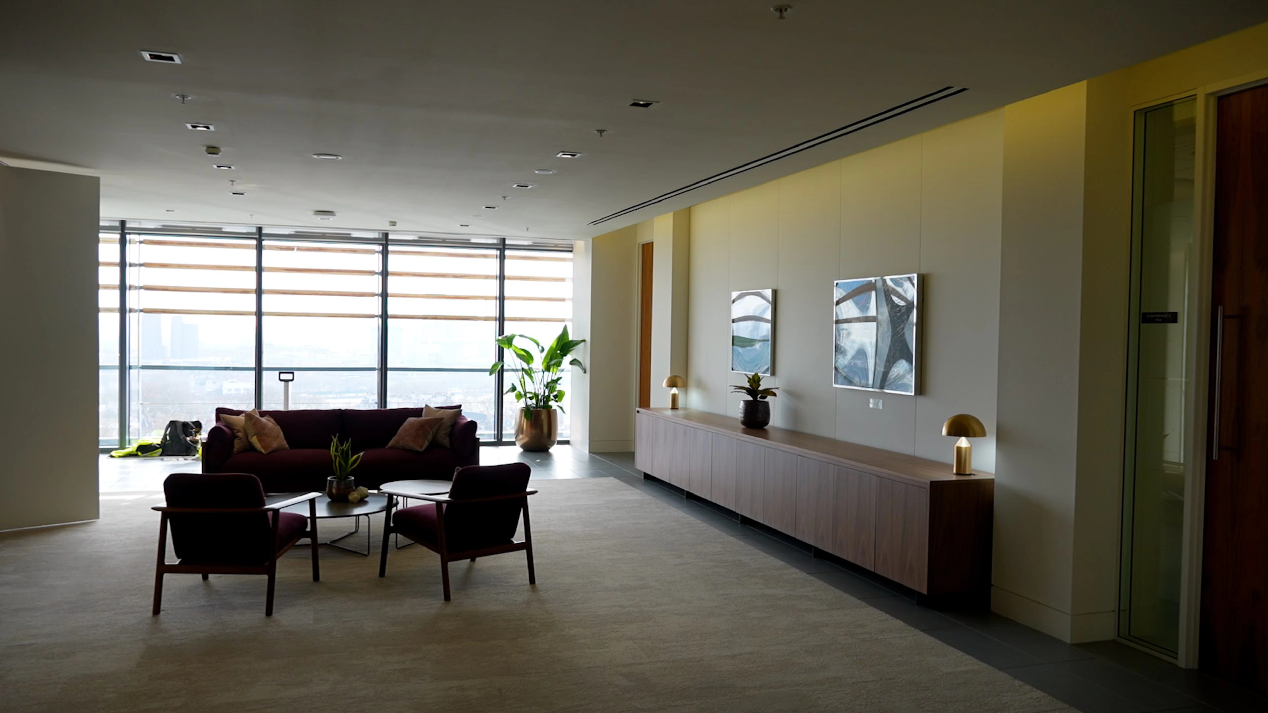 OMelveny – Reception Lounge with Sofas and Artwork
